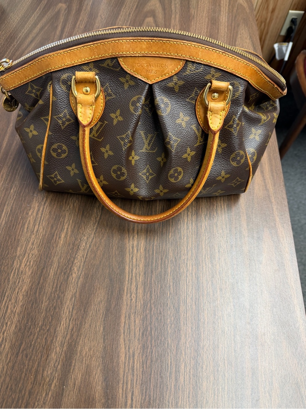 PREOWNED authentic Louis Vuitton Trivoli PM